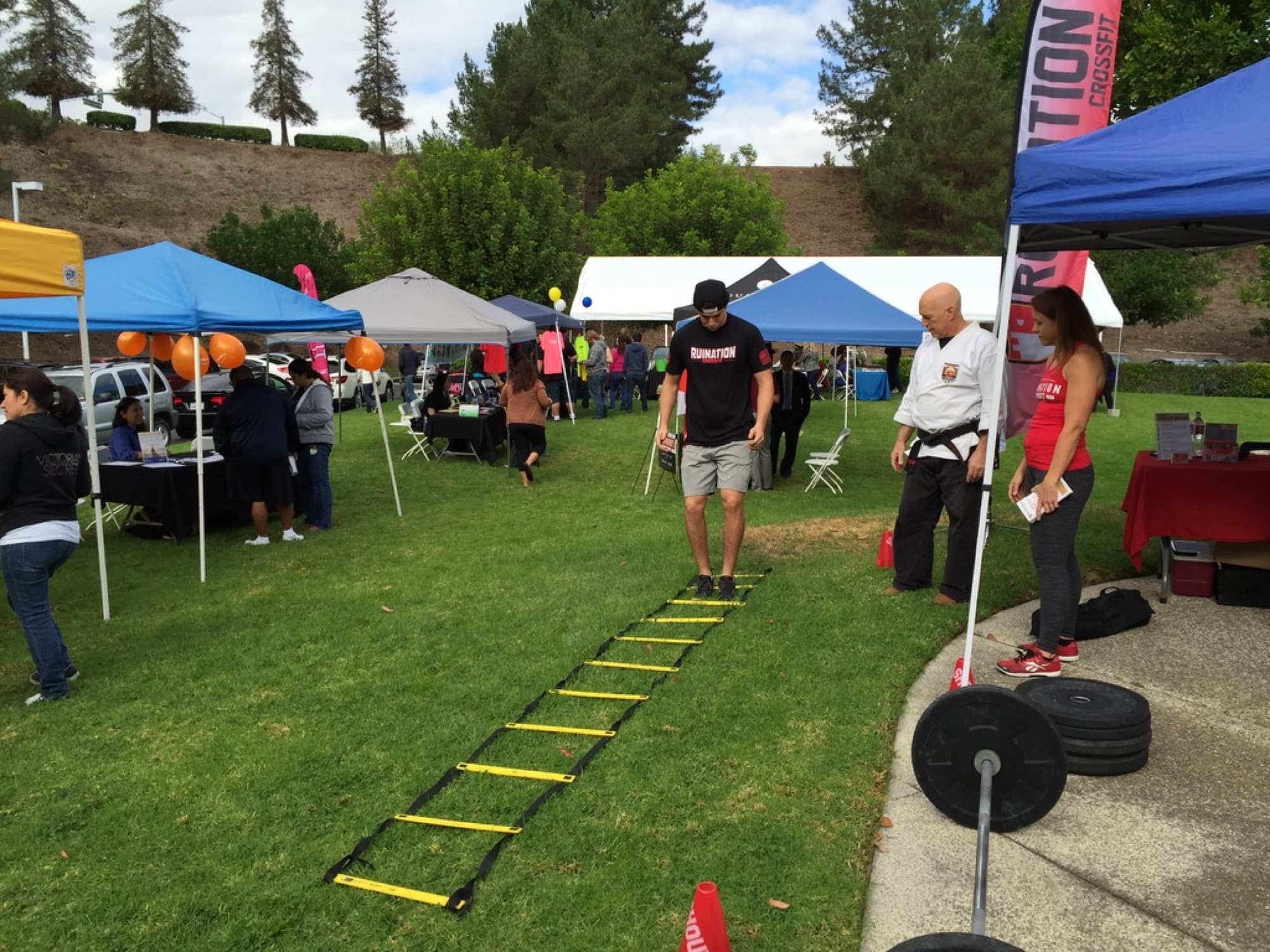 Tents and exhibitors at an outdoor corporate health fair